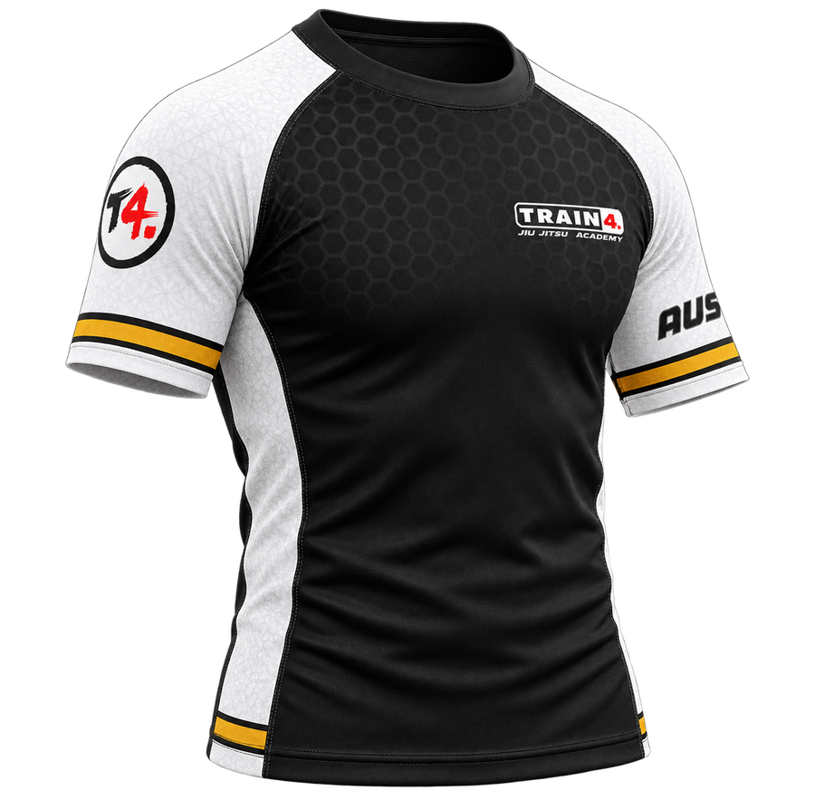 Train4 rashguard included with camp — black body, white sleeves and gold trim